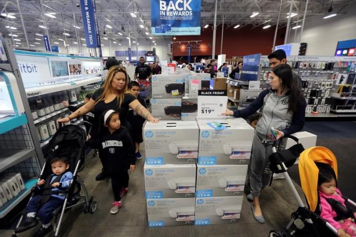 People shop for deals during Black Friday sales at a Best Buy store in Los Angeles