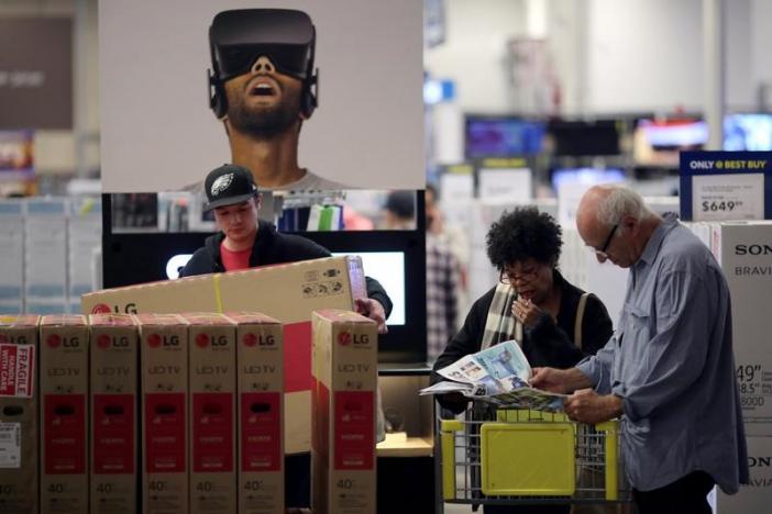 People shop for deals during Black Friday sales at a Best Buy store in Los Angeles