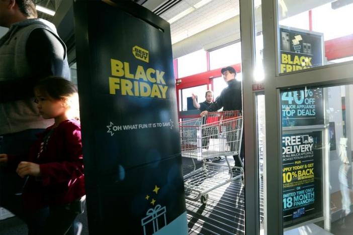 People enter to shop for deals as store doors open during Black Friday sales at a Best Buy store in Los Angeles